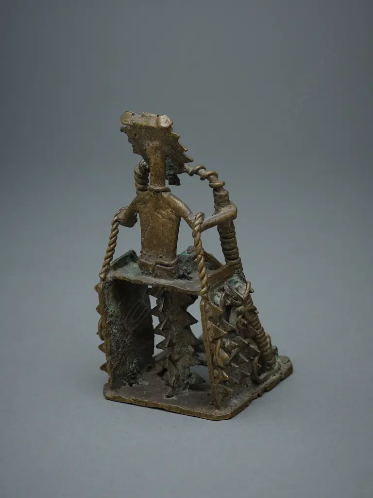 African brass and wire-formed seated figure, Image 1++